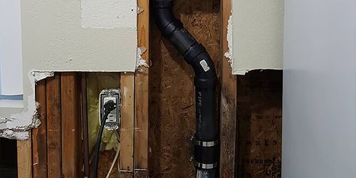 A drain pipe inside a wall